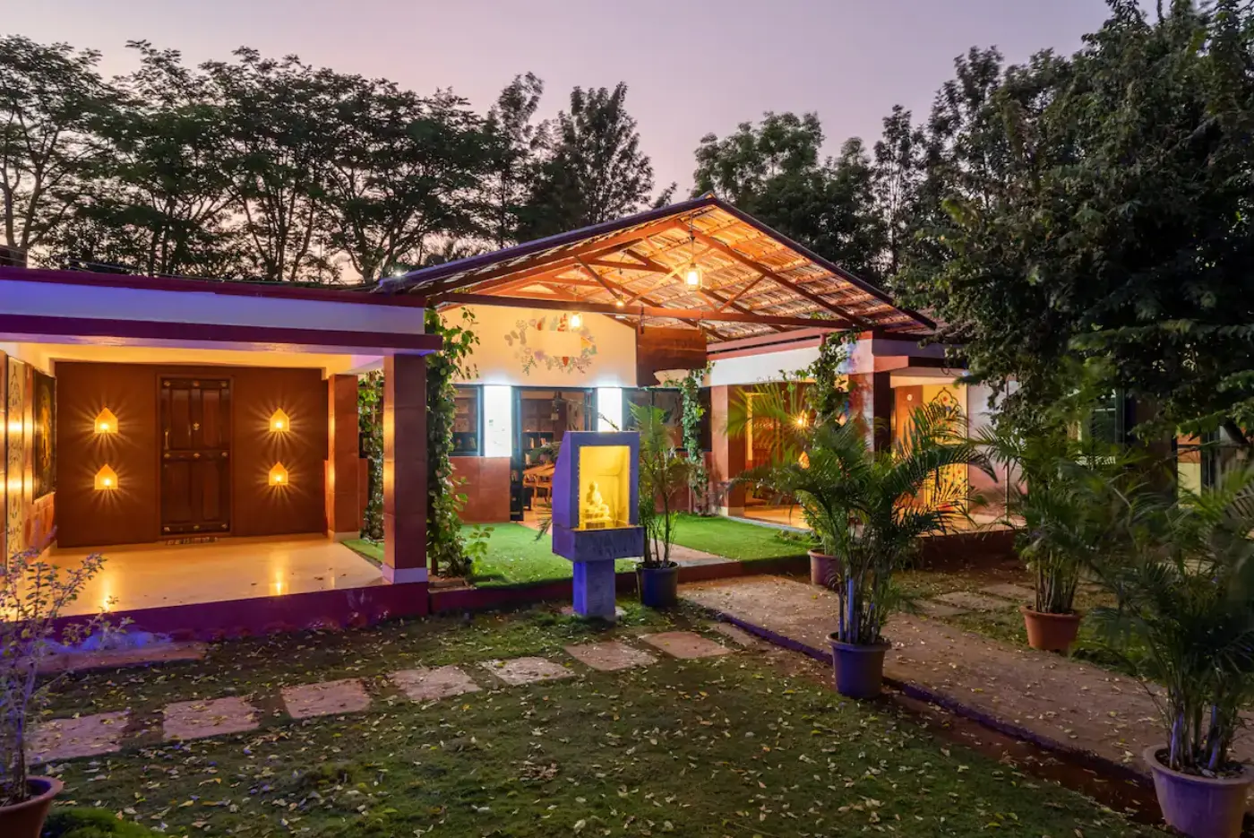 Ananta by Tattvam Retreat's Ayurvedic wellness pavilion, lit at dusk